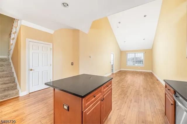 a bathroom with a granite countertop toilet sink and shower