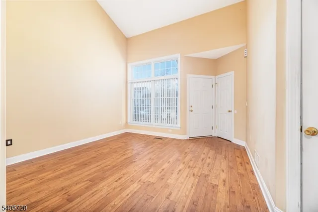 a living room with furniture and flowers