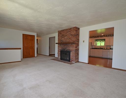 191 Warren Road Warrendale, PA 15086 - Photo 2 of 18 Living Room. Neutral carpet, log burning fireplace.