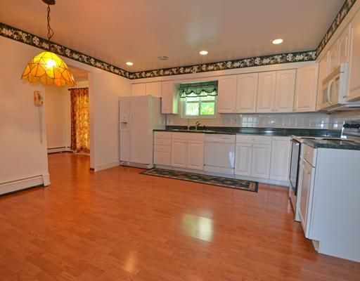 191 Warren Road Warrendale, PA 15086 - Photo 4 of 18 Kitchen. Large new eat-in kitchen in 2000, refrigerator, electric stove, dishwasher, disposer, ample cabinets and counter space, ceramic tile backsplash, laminate floor.