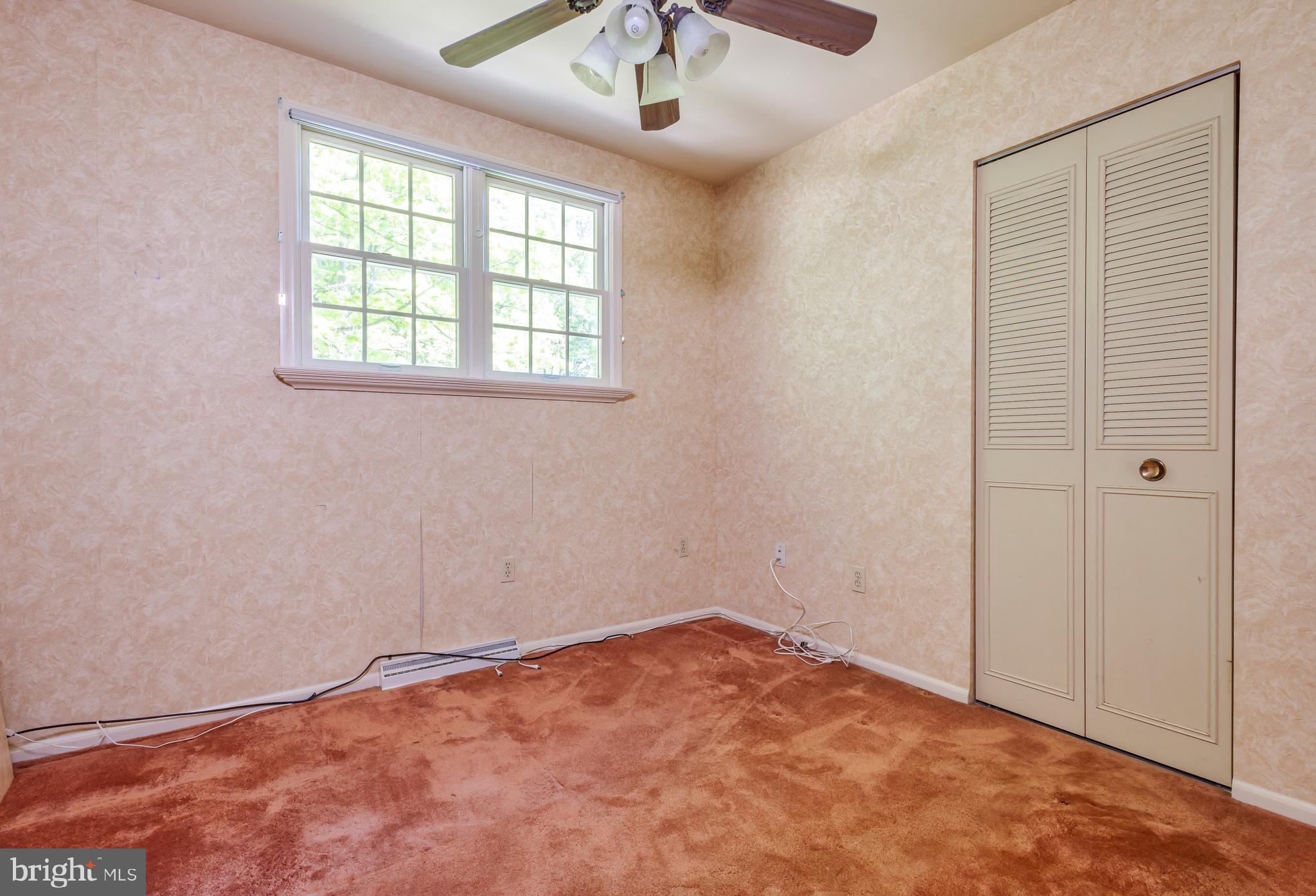 24 Cedar Creek Drive Clementon, NJ 08021 - Photo 16 of 28 an empty room with a window and a ceiling fan