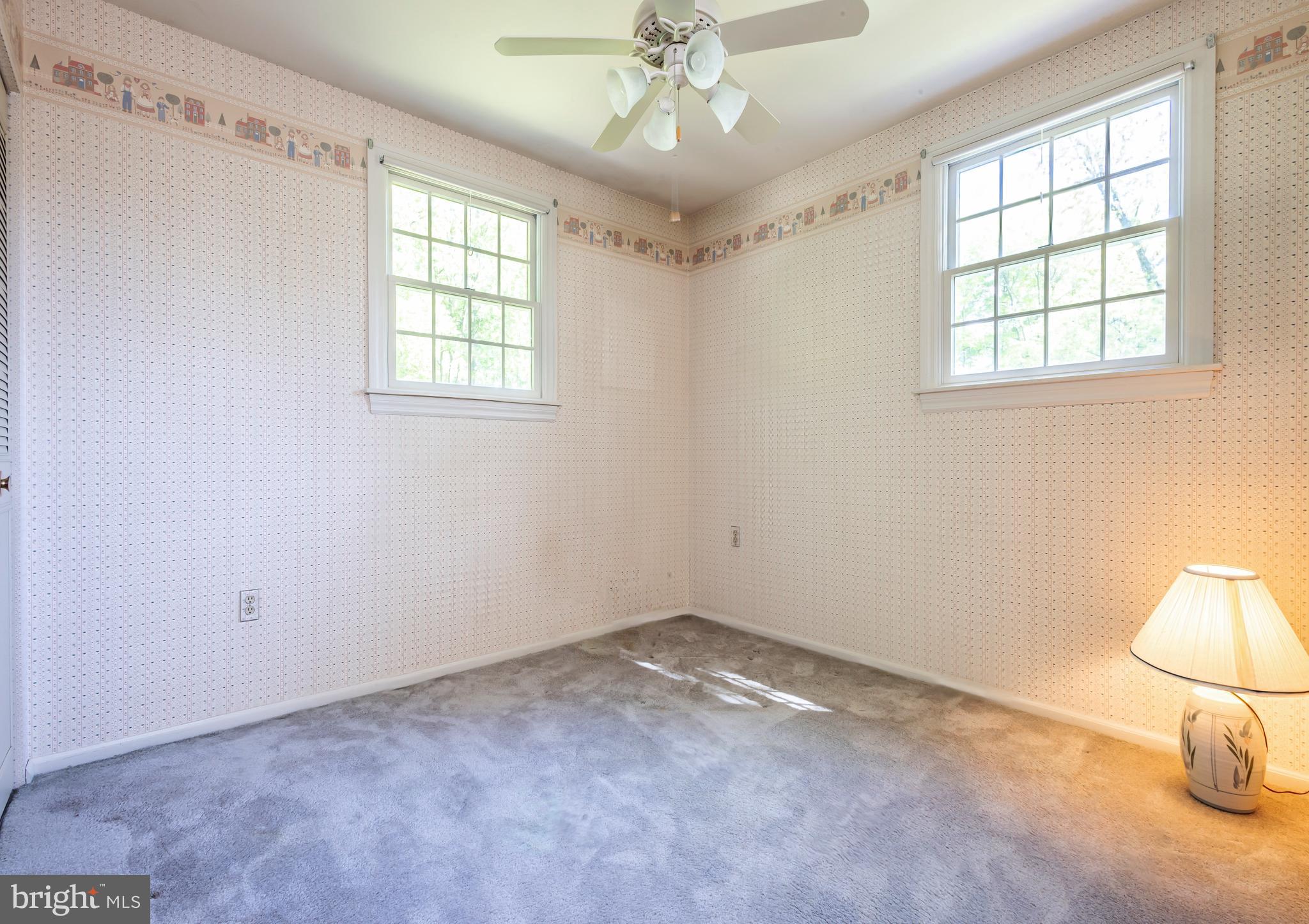 24 Cedar Creek Drive Clementon, NJ 08021 - Photo 19 of 28 an empty room with a window and chandelier fan