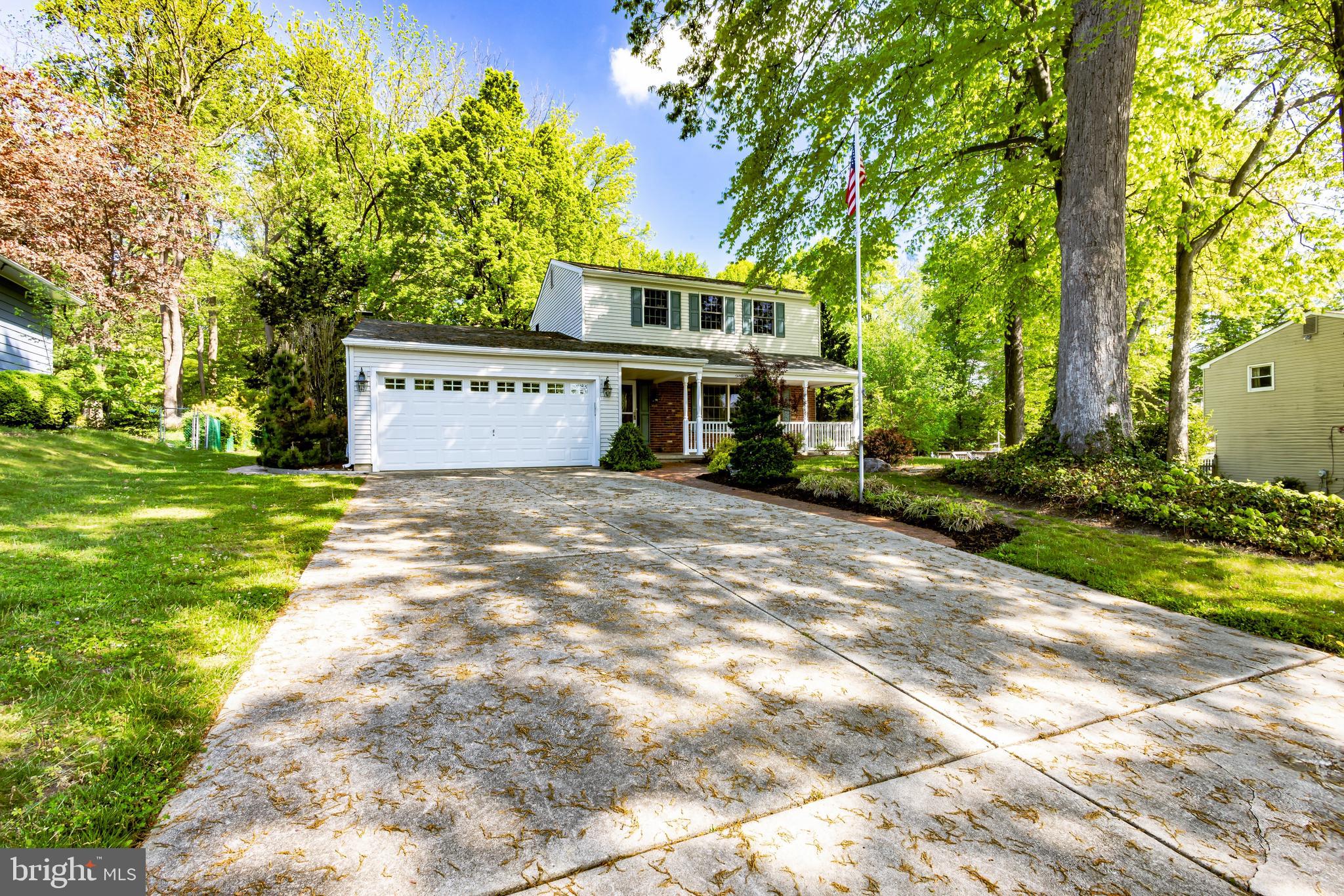 24 Cedar Creek Drive Clementon, NJ 08021 - Photo 2 of 28 a front view of a house with a yard and trees
