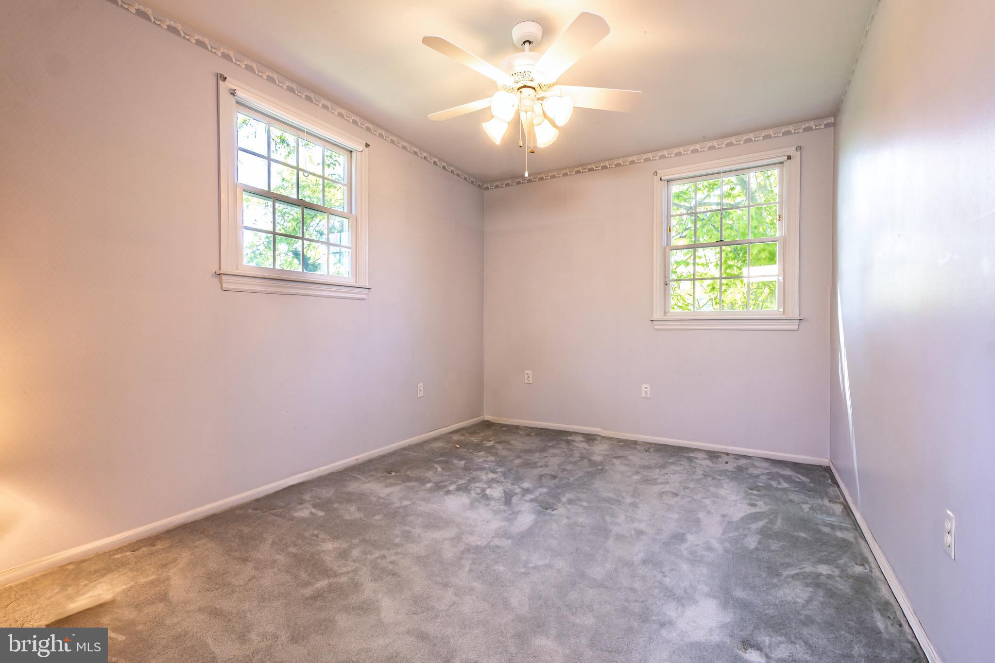 24 Cedar Creek Drive Clementon, NJ 08021 - Photo 21 of 28 an empty room with windows and ceiling fan