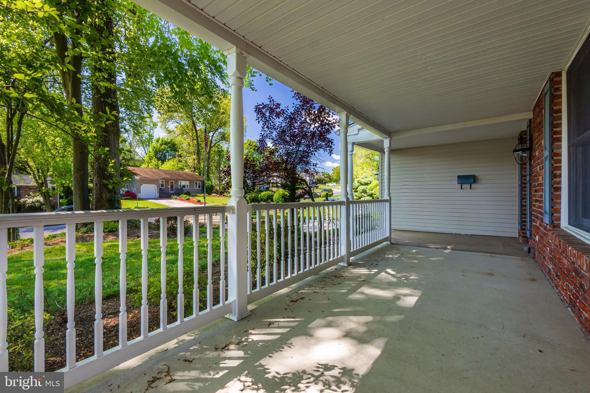 24 Cedar Creek Drive Clementon, NJ 08021 - Photo 3 of 28 a view of a porch with a floor to ceiling window and wooden fence