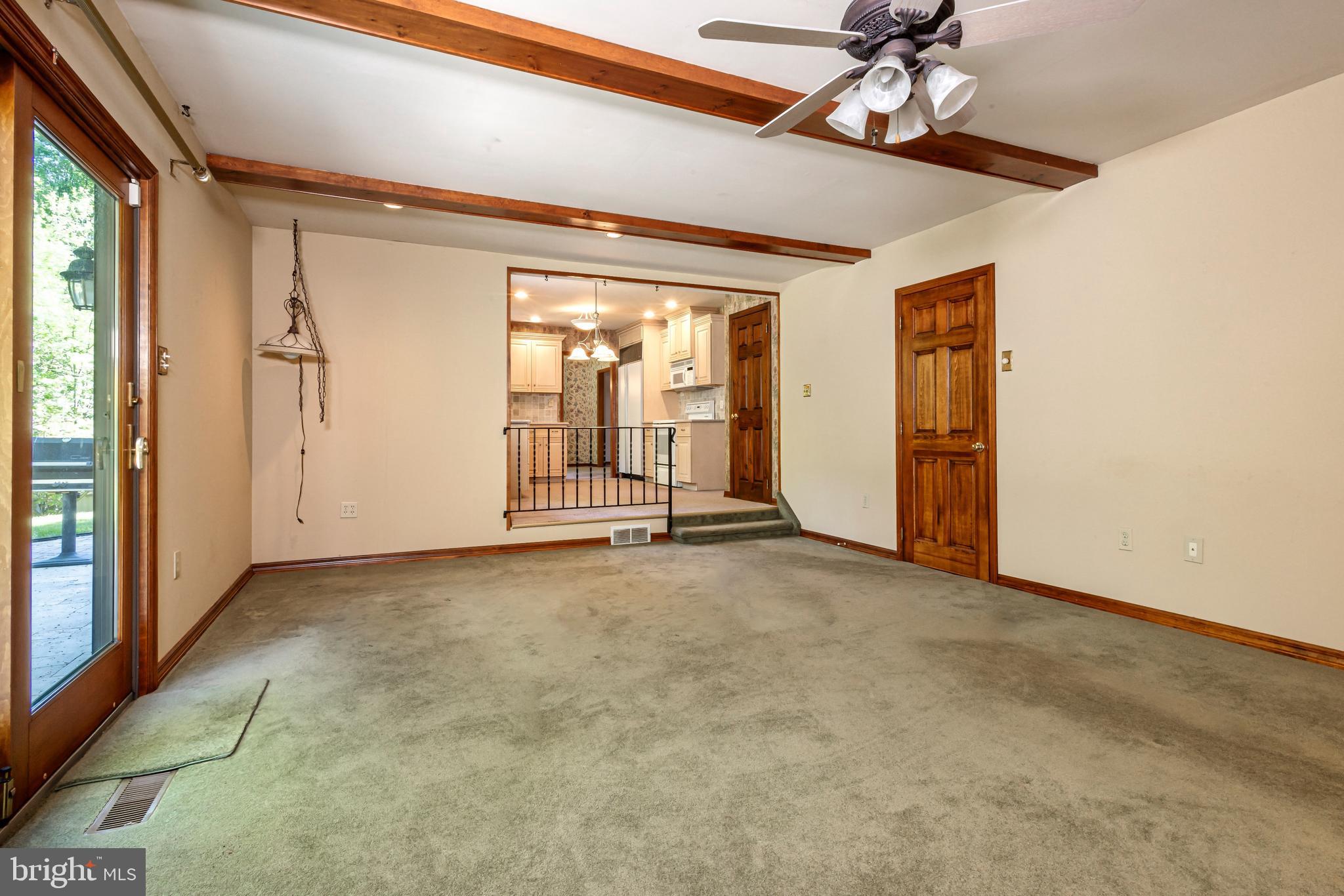 24 Cedar Creek Drive Clementon, NJ 08021 - Photo 6 of 28 an empty room with a ceiling fan and windows