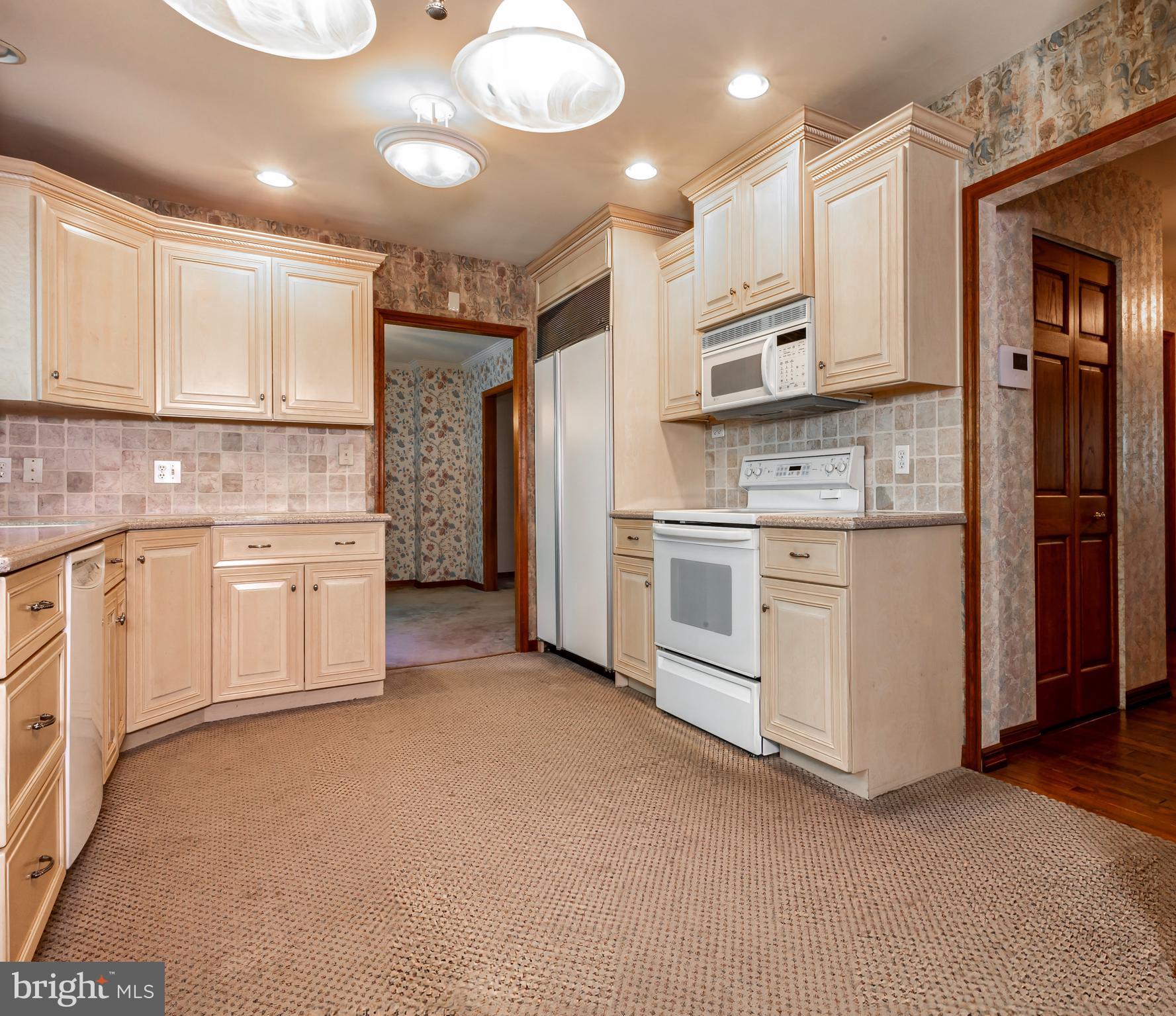 24 Cedar Creek Drive Clementon, NJ 08021 - Photo 10 of 28 a kitchen with stainless steel appliances granite countertop a stove a sink and a refrigerator