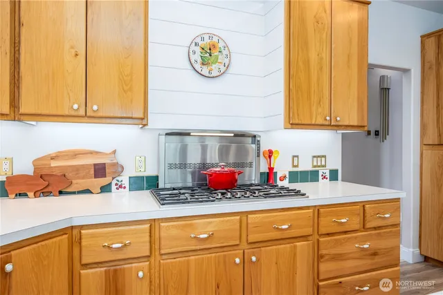 a kitchen with stainless steel appliances granite countertop a sink and cabinets