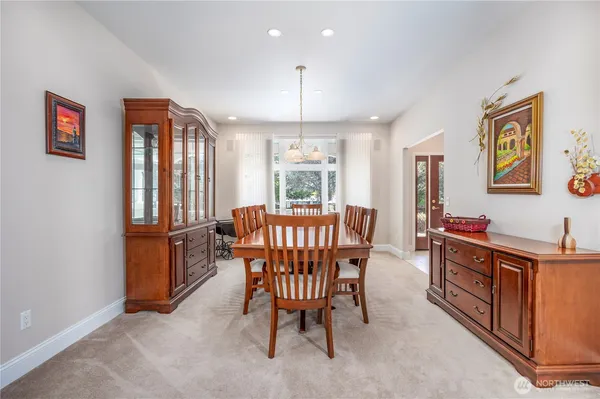 a view of a dining room with furniture window and outside view