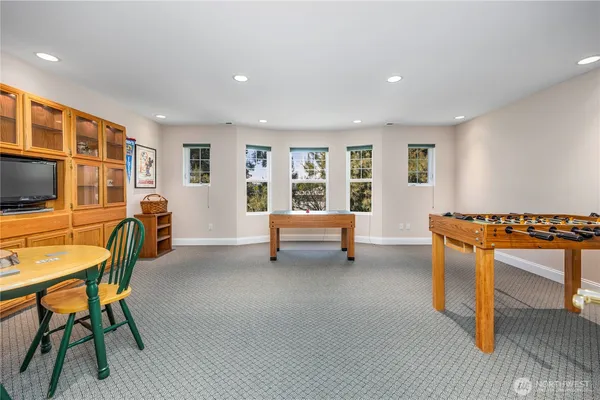 a view of a livingroom with furniture and a window