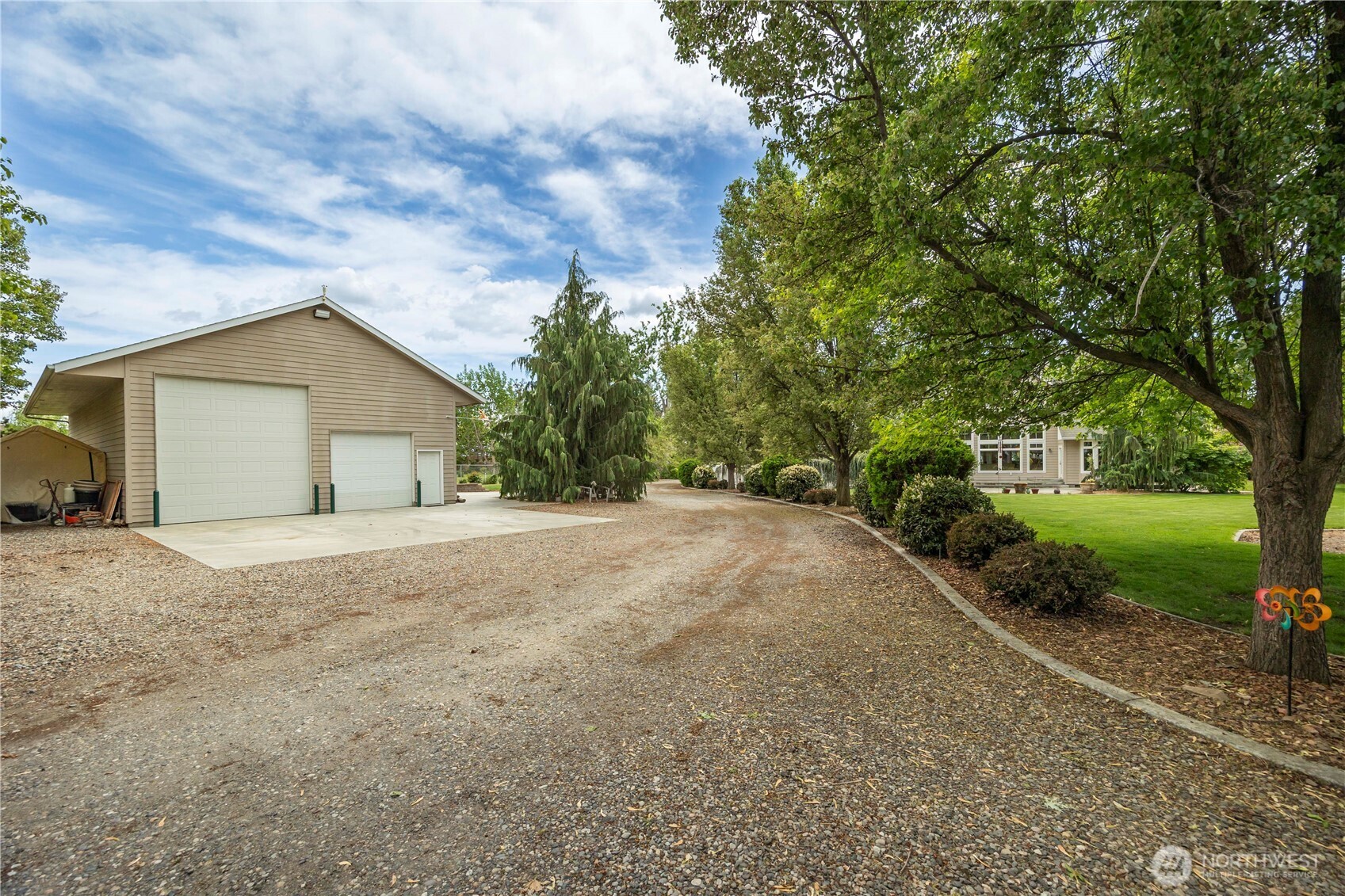 8620 Richardson Road Pasco, WA 99301 - Photo 3 of 40 a view of a house with a yard and large tree