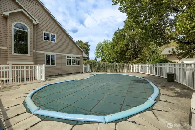 a view of a wooden deck with a backyard
