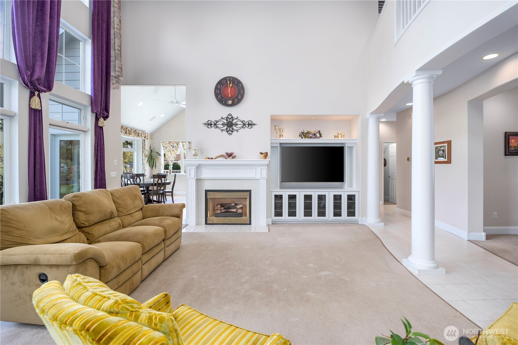 8620 Richardson Road Pasco, WA 99301 - Photo 7 of 40 a living room with furniture a flat screen tv and a fireplace