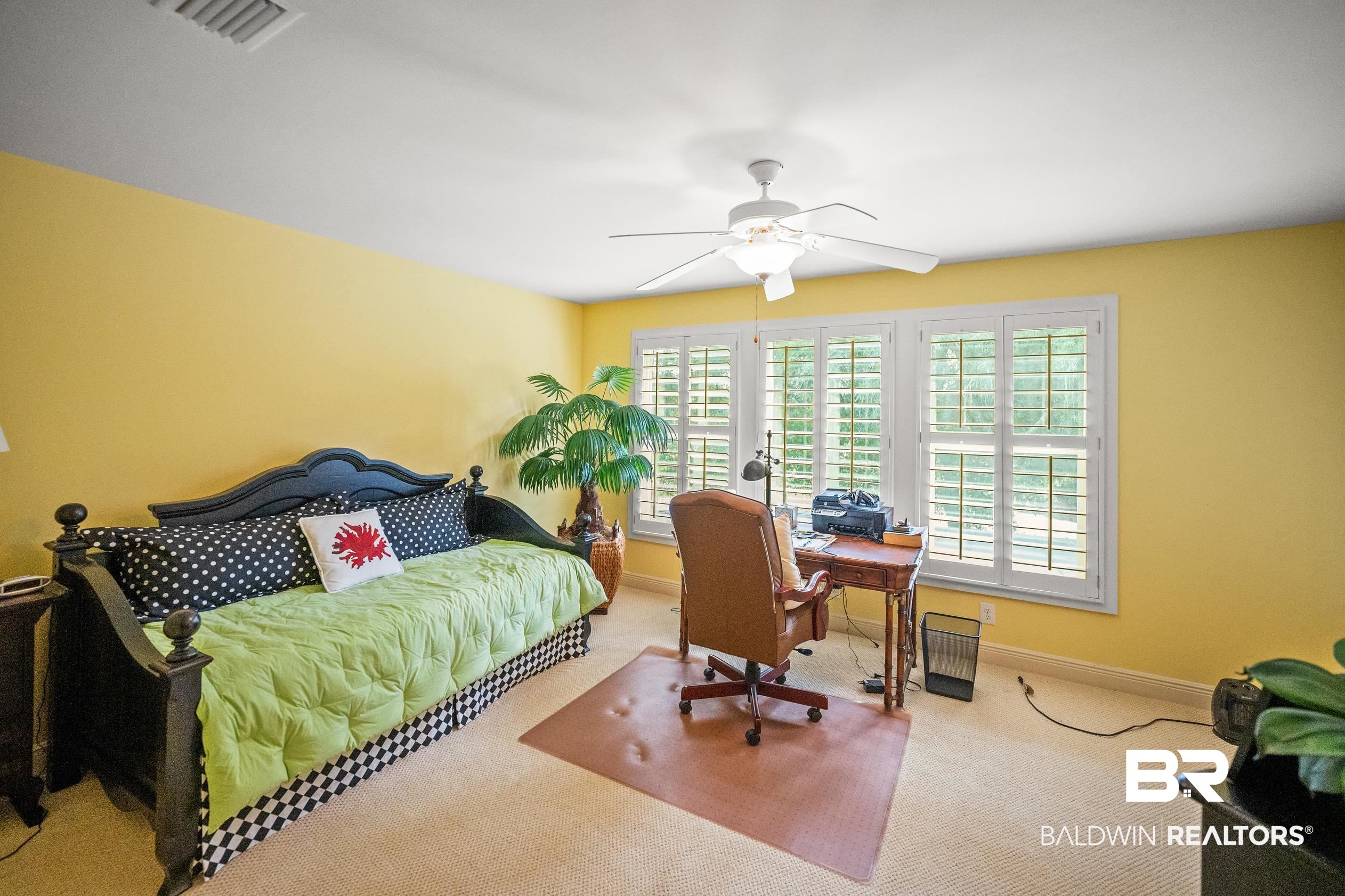 404 Peninsula Boulevard Gulf Shores, AL 36542 - Photo 29 of 51 Carpeted bedroom with an office area and ceiling fan