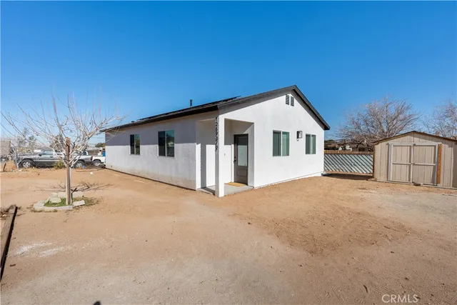 a front view of a house with a garage