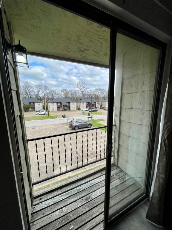 2406 Toro Lane, Unit B Bryan, TX 77807 - Photo 12 of 13 a view of a balcony with wooden floor