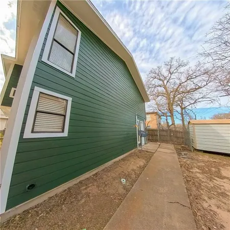 a view of a back yard of the house