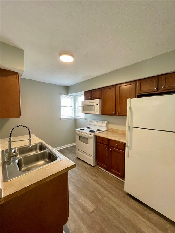 2406 Toro Lane, Unit B Bryan, TX 77807 - Photo 6 of 13 a kitchen with a refrigerator sink and stove