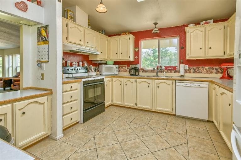 2388 Old Military Road Central Point, OR 97502 - Photo 18 of 35 a kitchen with cabinets and window
