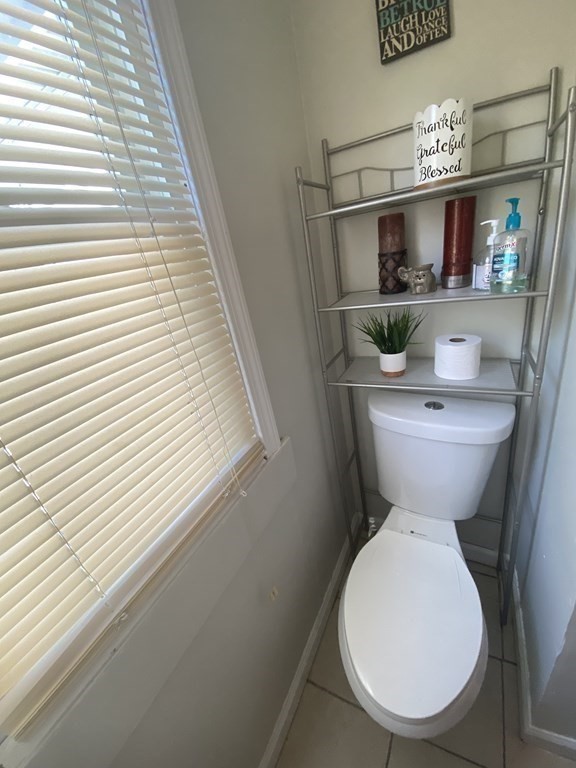 282 Commonwealth Avenue Springfield, MA 01108 - Photo 19 of 19 a bathroom with a toilet a sink and mirror