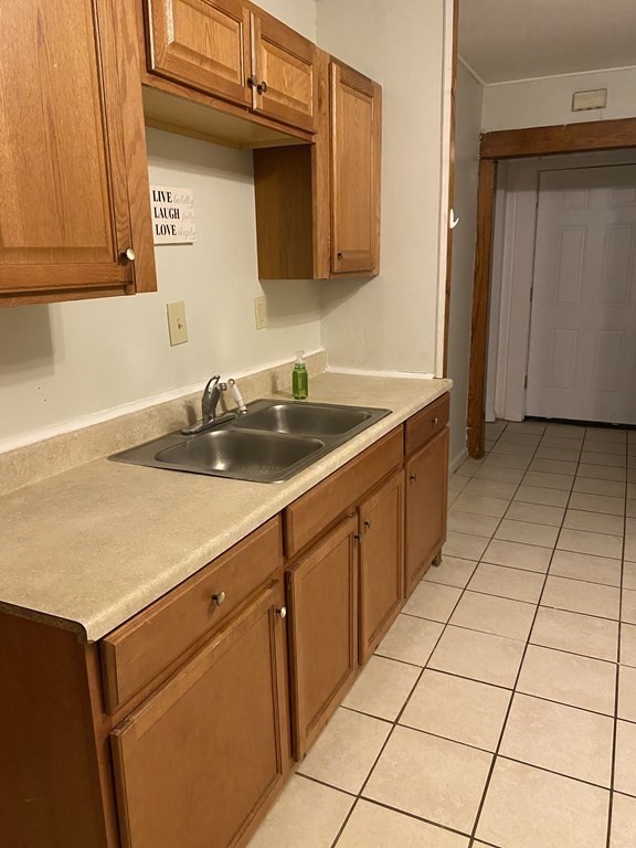 282 Commonwealth Avenue Springfield, MA 01108 - Photo 5 of 19 a kitchen with a sink and cabinets