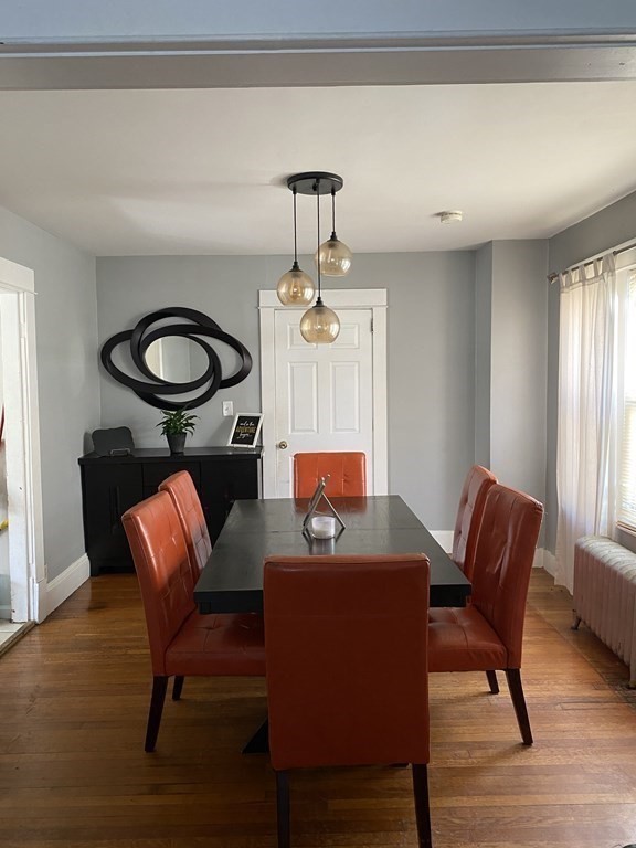 282 Commonwealth Avenue Springfield, MA 01108 - Photo 7 of 19 a view of a dining room with furniture and wooden floor