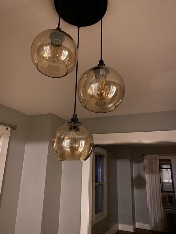 282 Commonwealth Avenue Springfield, MA 01108 - Photo 8 of 19 a view of a chandelier fan and kitchen view