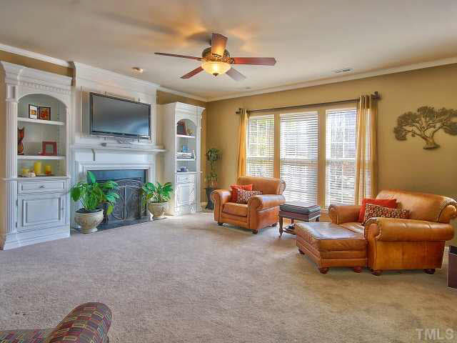5409 Griffith Park Road Raleigh, NC 27613 - Photo 7 of 25 Your family room has an amazing gas fireplace with a mantle and built in book shelves!