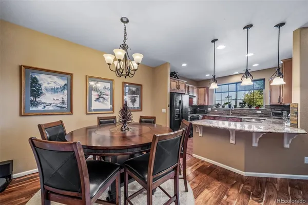 a dining room filled with a large window