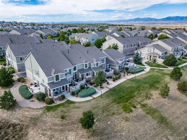 an aerial view of a house with a garden