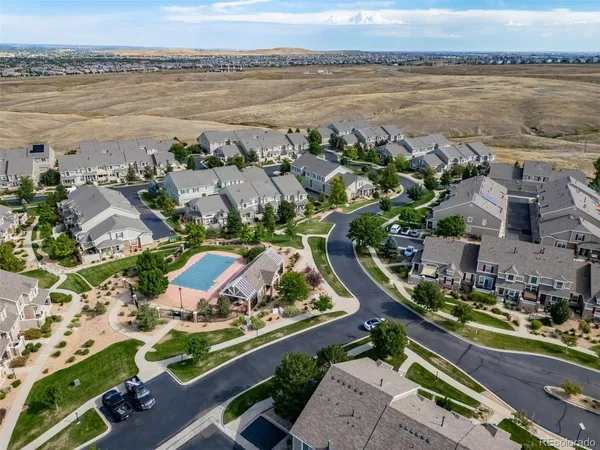 an aerial view of residential houses with outdoor space