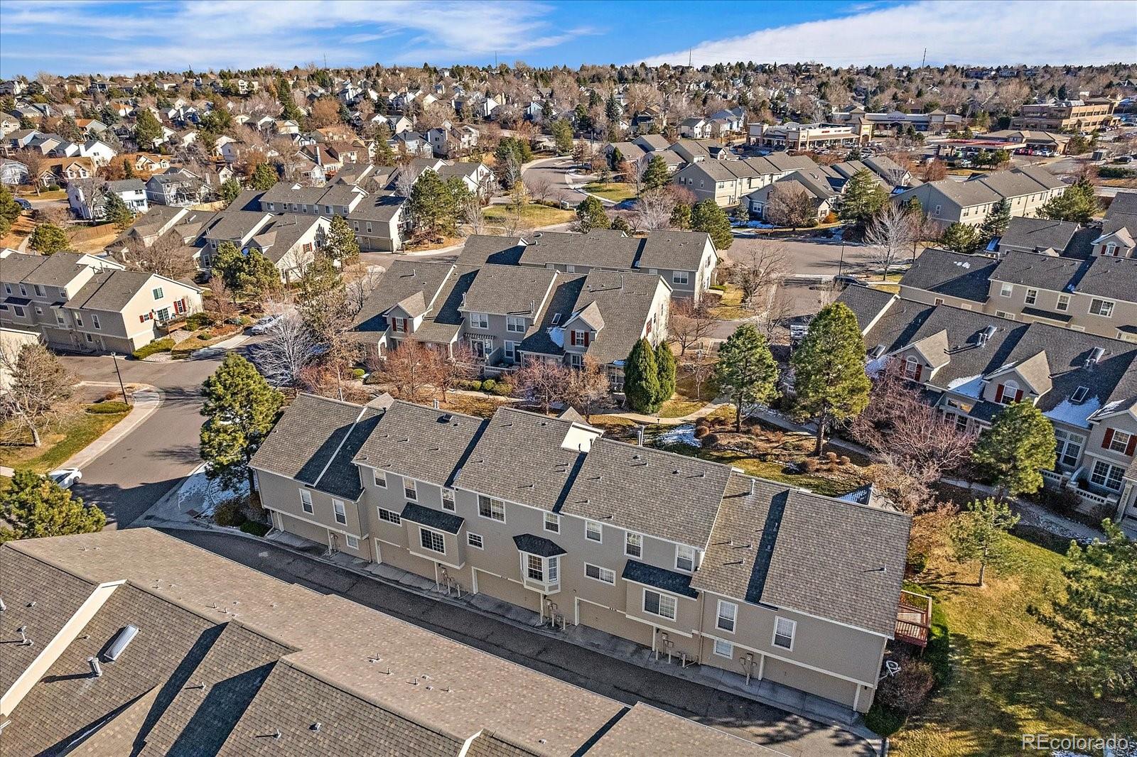 6318 Trailhead Road Highlands Ranch, CO 80130 - Photo 28 of 32 an aerial view of a city with lots of residential buildings