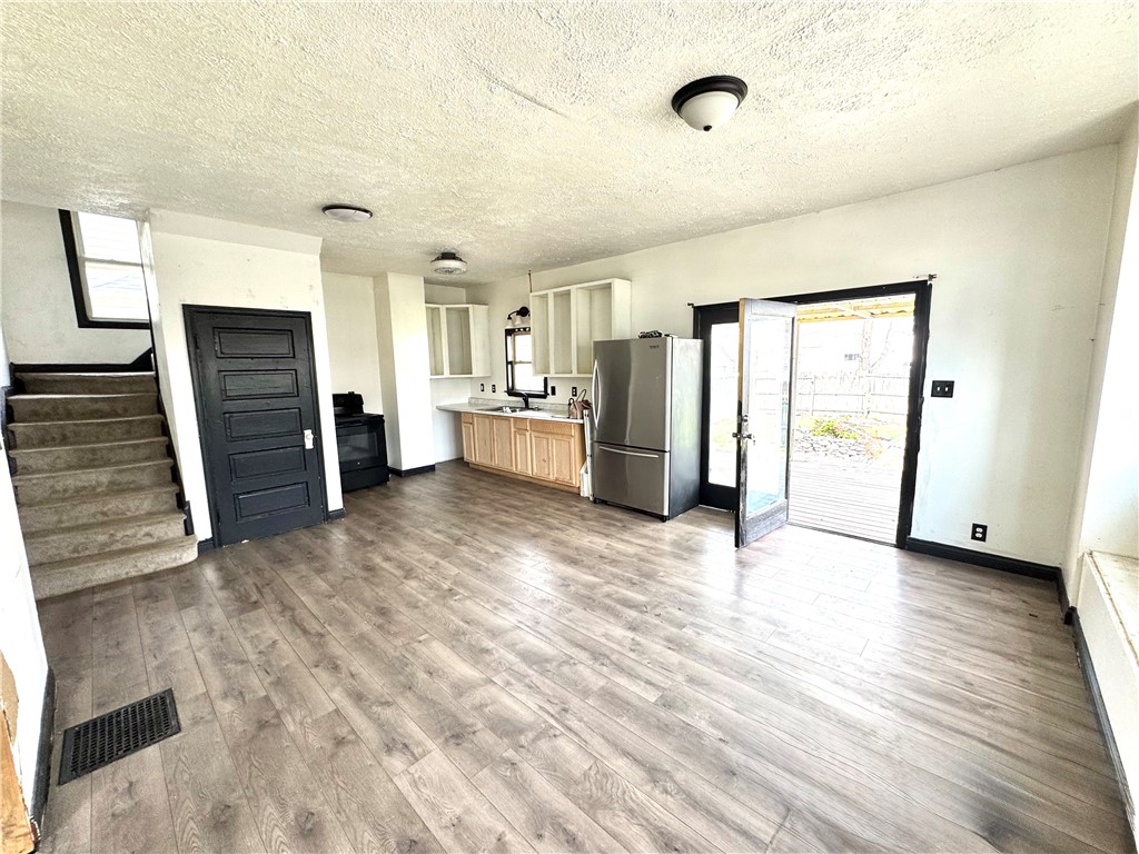 348 Fairview Avenue Hamilton, OH 45015 - Photo 5 of 9 This versatile space combines a functional kitchen area with comfortable living, offering both practicality and relaxation.