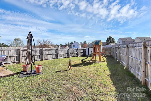 a view of backyard of house and outdoor seating