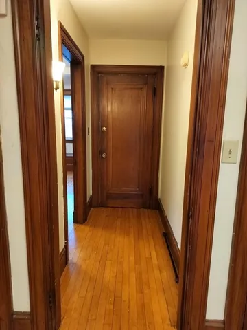 a view of house with yard and potted plants