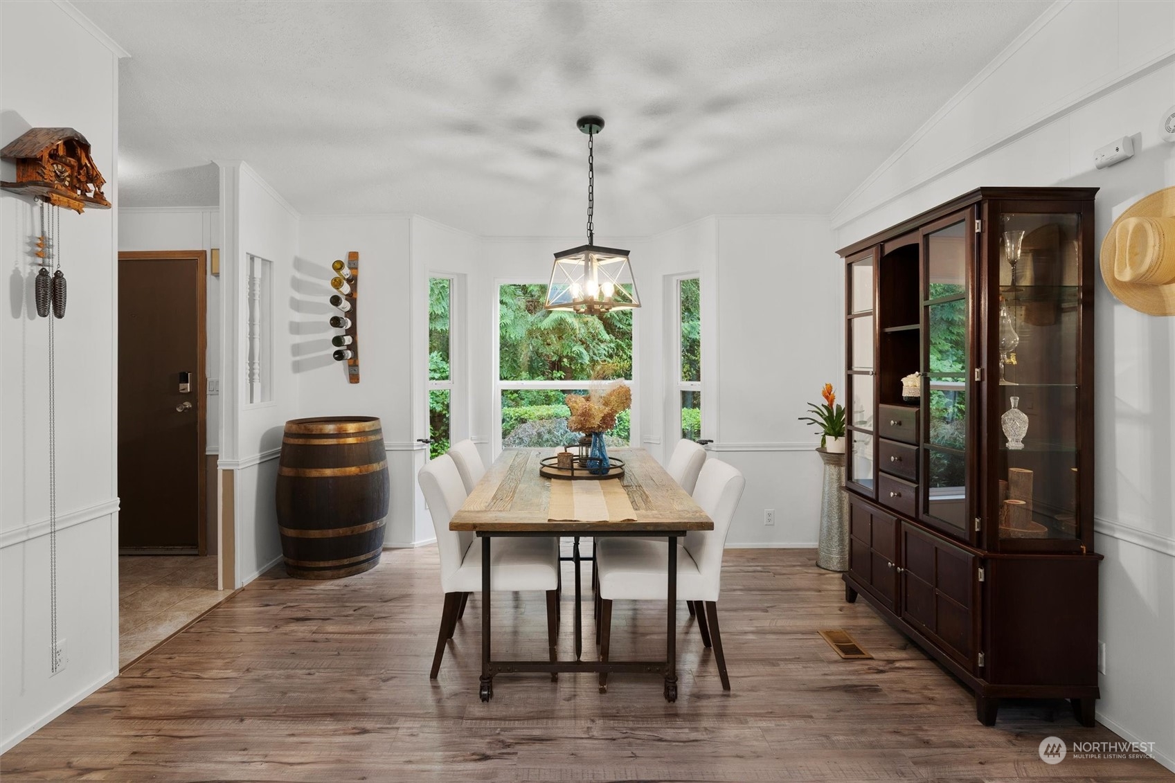 22514 53rd Avenue Southeast Bothell, WA 98021 - Photo 5 of 40 a view of a dining room with furniture window and wooden floor
