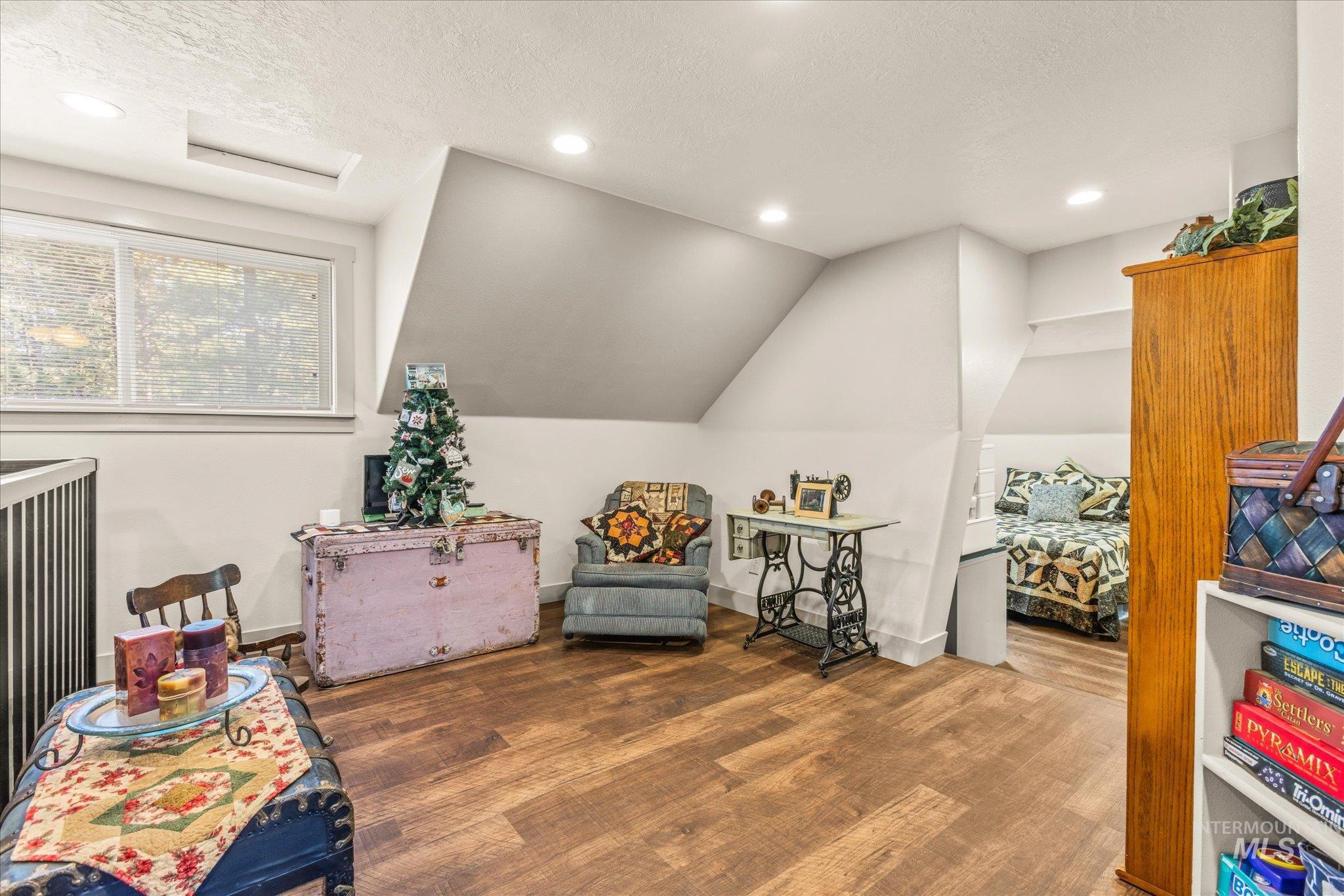 1 Sunset Trail Banks, ID 83602 - Photo 26 of 42 Spacious secondary room featuring wood-finish flooring, recessed lighting, and a window providing natural light