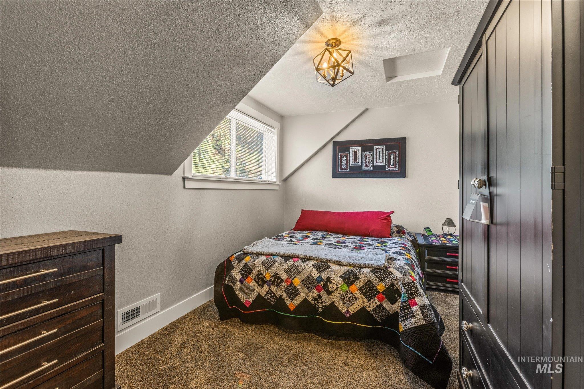 1 Sunset Trail Banks, ID 83602 - Photo 28 of 42 Carpeted room featuring an angled ceiling and a single window
