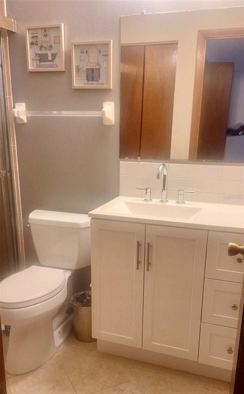 8417 Southwest 106th Street Ocala, FL 34481 - Photo 18 of 49 a bathroom with a sink a toilet and mirror