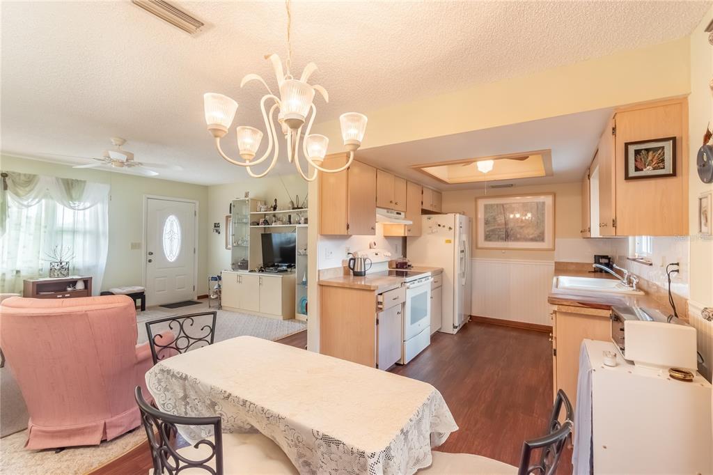 8417 Southwest 106th Street Ocala, FL 34481 - Photo 21 of 49 a large kitchen with a table and chairs