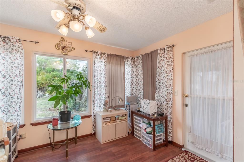 8417 Southwest 106th Street Ocala, FL 34481 - Photo 22 of 49 a living room with furniture and a large window