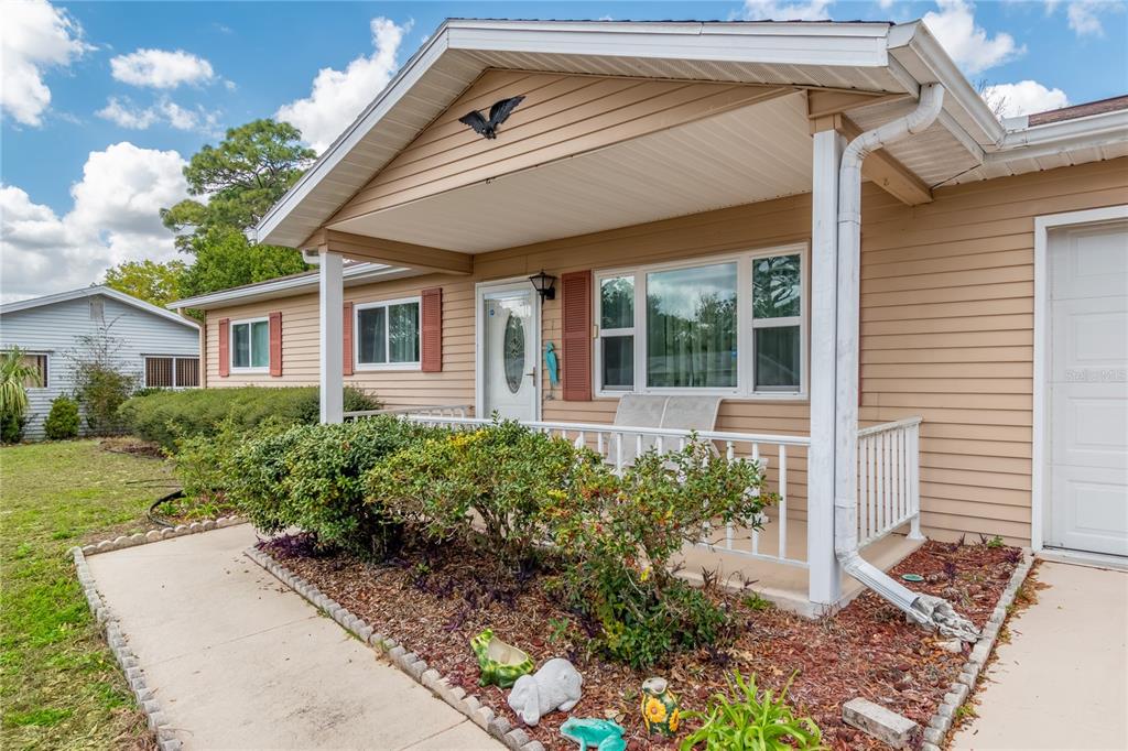 8417 Southwest 106th Street Ocala, FL 34481 - Photo 24 of 49 a view of a house with a garden