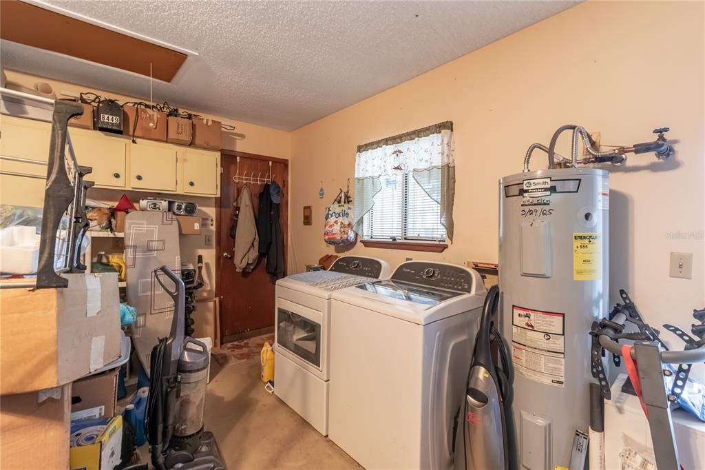 8417 Southwest 106th Street Ocala, FL 34481 - Photo 26 of 49 a view of a storage & utility room with washer and dryer