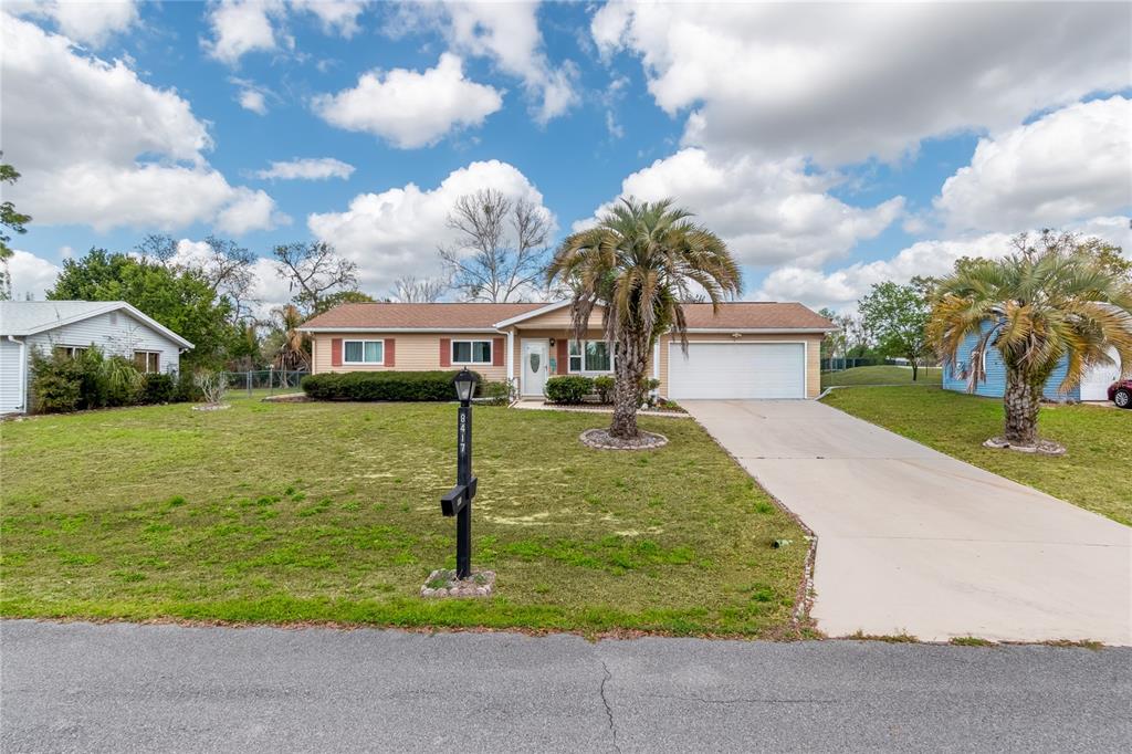 8417 Southwest 106th Street Ocala, FL 34481 - Photo 29 of 49 a front view of house with yard