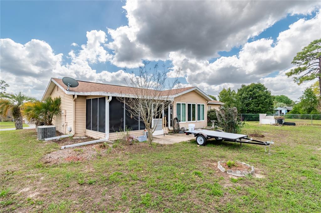 8417 Southwest 106th Street Ocala, FL 34481 - Photo 32 of 49 a view of a house with swimming pool and sitting area