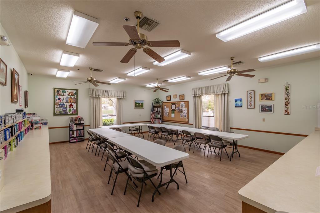 8417 Southwest 106th Street Ocala, FL 34481 - Photo 48 of 49 a view of a dining area with furniture and wooden floor