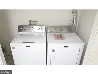 a black and white photo of a living room