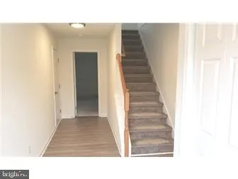 a kitchen with a refrigerator a stove top oven a sink and dishwasher