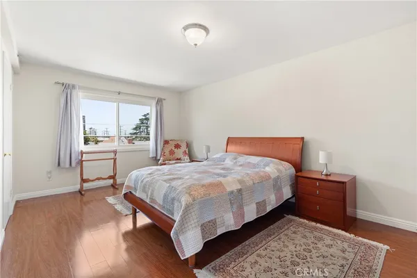 a bedroom with a bed and a chair