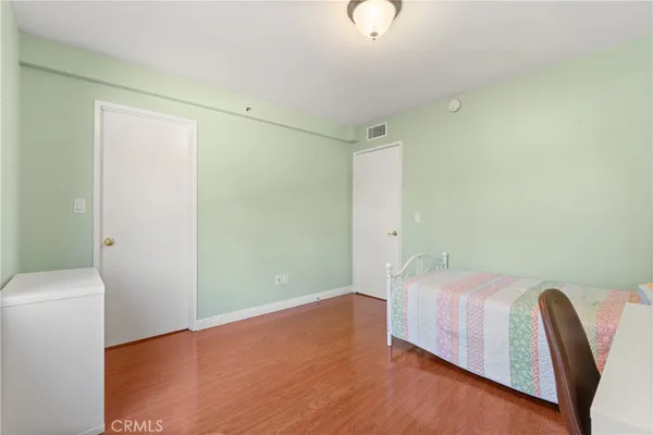 a bedroom with furniture and a window